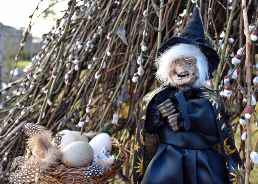 Scandinavian tradition for Easter - Easter witch. Witch at Easter nest on branches. Traditional Swedish decorations for Easter.