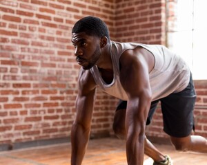 Obraz premium Athlete preparing sprint indoors.