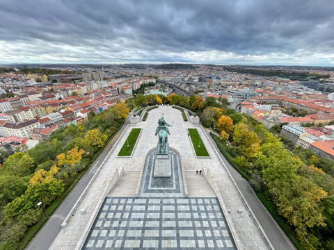 Aerial view toward historic Prague city center with Jan Zizka monument visible, Czech Republic, urban landscape and travel