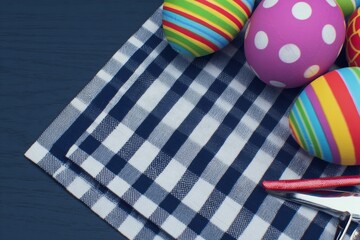 Fototapeta premium Elegant easter egg display on a dark blue canvas. Daily life. Exquisite easter scene with detailed egg art and textured napkins. Simple life. Natural mood.