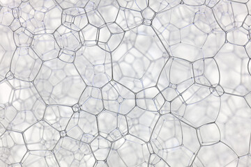 Extreme macro view highlighting geometric bubble patterns and thin reflective walls. Clean, minimal, technical texture ideal for scientific and industrial abstract uses.