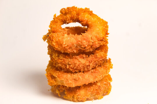 pile of onion rings isolated on white background