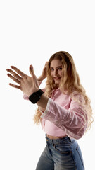 Young woman presenting smartwatch on wrist isolated on white background. Concept of wearable gadget promotion, smart device marketing, mobile technology and modern lifestyle electronics.