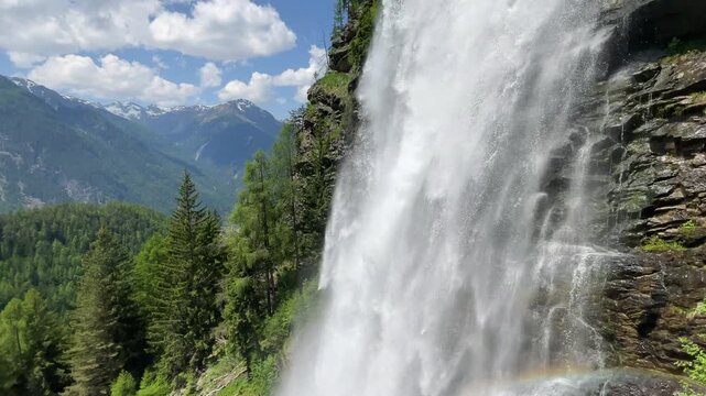 Stuibenfall waterfall bigest waterfall in Tirol in the Otztal valley in Tyrol Austria during a beautiful springtime day in the Alps. Vertical video.