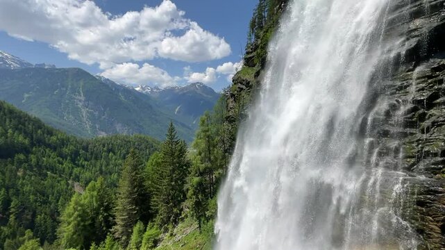 Stuibenfall waterfall bigest waterfall in Tirol in the Otztal valley in Tyrol Austria during a beautiful springtime day in the Alps. Vertical video.