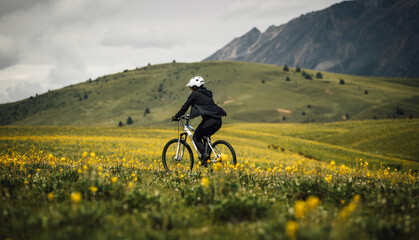 Riding mountain on the alpine grassland
