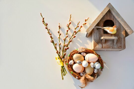 Willow branches and a nest with Easter eggs, a birdhouse. Happy Easter! Glad P&aring;sk! (in Swedish)