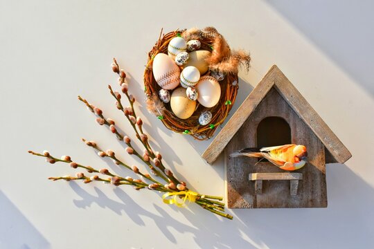 Willow branches and a nest with Easter eggs, a birdhouse. Happy Easter! Glad P&aring;sk! (in Swedish)