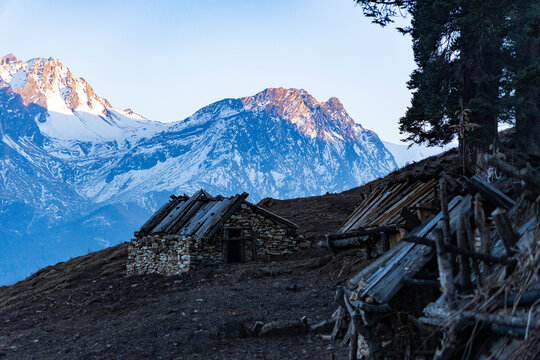 Shepherd hut made with stone with snowy mountains in background in Dolpo, Nepal | Yaltingey Danda in Ruppatan | Dolpa, Nepal