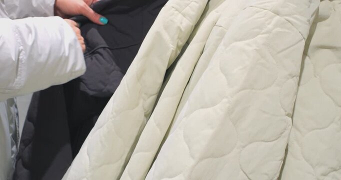 Woman's Hands Checking Fabric Quality at Store