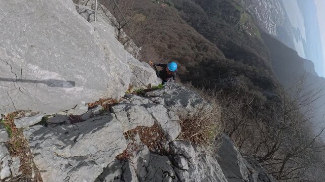 Via Ferrata Corno Rat, Valmadrera, Lecco, Lombardia - 22 climbers ascend the via ferrata on vertical walls with sweeping views of the city
