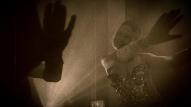 old film 1920s style black and white color, shadow silhouette two woman dancing in night club. Sexy girls friends together flapper female have fun at dance floor retro party new year roaring twenties.