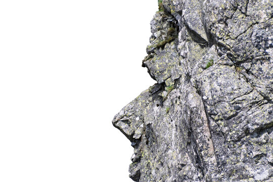 Weathered rock face showing textured granite surface on cliff. Isolated object