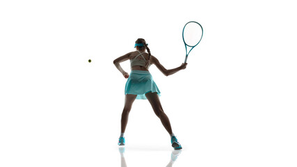 Naklejka premium Female tennis player mid air movement during intense play isolated on white. Concept of high intensity training, athletic performance focus, strength and control, game day energy.