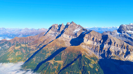 Aerial View of the Dents du Midi Mountain Range (3257 m) in the Swiss Alps with Sea of Clouds and...