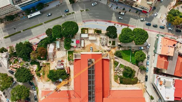 Aerial view of Platia Agoras with its red roofs and verdant trees, creating a vibrant contrast against the urban landscape, Chania, Chania, Greece.