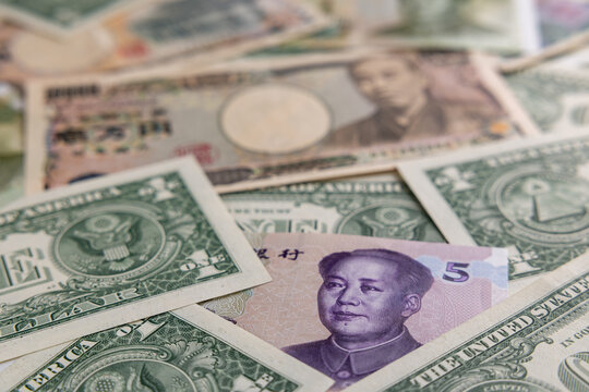 Multicurrency Collage Featuring Japanese Yen, US Dollars, and Chinese Yuan