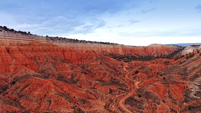 Red Canyon of Teruel, Spain set against overcast sky. Amazing tourist attraction from drone footage.