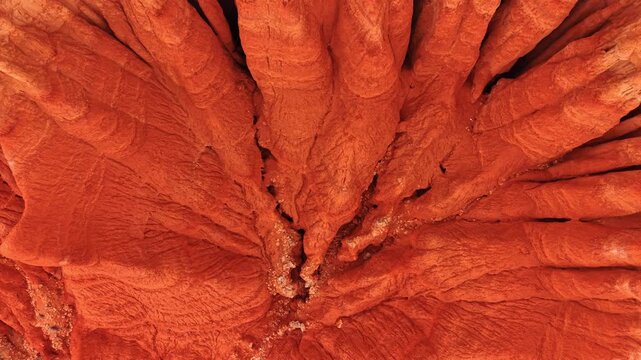 Descending to the base of the ridged red rocks created by water and wind erosion. Spectacular geological formations of the mountains in Spain.
