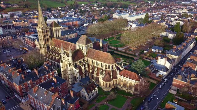 Saint-Pierre Cathedral and the formal Bishop's Garden, Lisieux in Normandy, France. Aerial drone forward descending