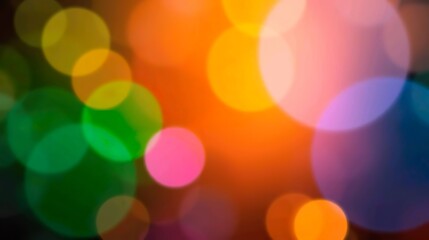 Obraz premium Abstract blurred macro background featuring soft bubble-like circular shapes in green, blue, and violet tones over a bright orange and yellow gradient.