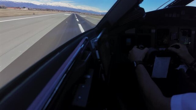 Immersive pilot&rsquo;s perspective in a real time takeoff from an Italian aiport near the Snowed Alps in a bright winter day.