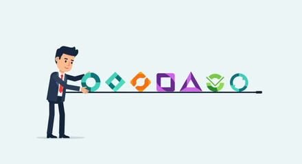 Businessman arranging diverse geometric shapes on a line