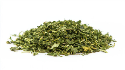 A heap of dried green herbs, resembling parsley or cilantro, is presented against a stark white backdrop in a studio shot, highlighting its texture and color.