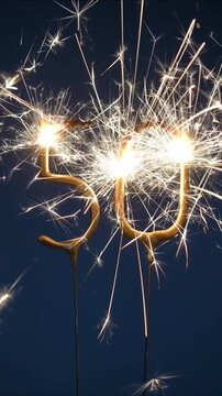 50 years anniversary celebration festive footage made with Bengal fire in the form of number Fifty. Vertical video.