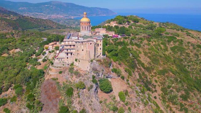 Aerial drone view of the Sanctuary of Tindari in Sicily, overlooking the stunning Mediterranean coast and lagoons. A breathtaking blend of history, faith, and Sicilian landscape from above.
