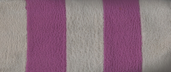 Soft furry fiber fabric texture with purple and white alternating vertical stripe pattern © Jus