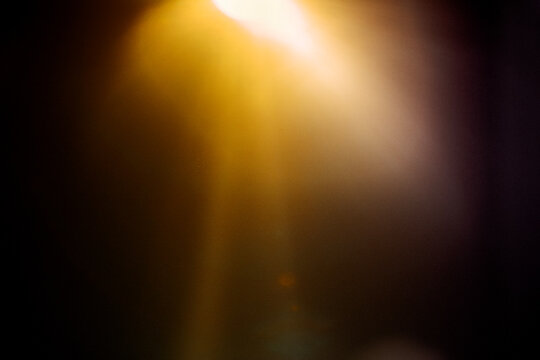 Shiny sun, sunbeams, sunrays, sunshine design. Yellow warm light effect, sun rays, golden beams isolated on black background. star dus