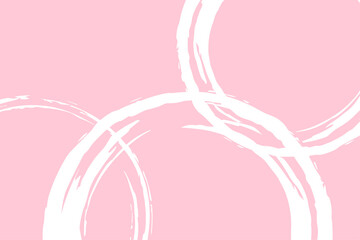 ピンクの背景に白いラフなブラシ円が描かれた背景