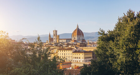 Fototapeta premium Florence cityscape with Brunelleschi's Dome and Giotto's Bell Tower, historic architecture against a clear sky