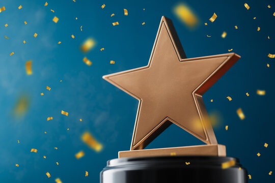 A golden star award sits atop a black base surrounded by celebratory confetti.