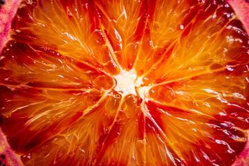 Obraz premium Vibrant orange zest reveals intricate patterns of a blood orange cut in half