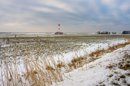 the lighthouse Leuchtfeuer Tossens during a cloudy winter day