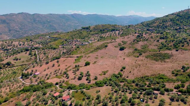 Cinematic aerial drone panorama of Tusa, Sicily. Historic hill town overlooking the Tyrrhenian coast with traditional Mediterranean architecture, scenic mountain landscape and panoramic views