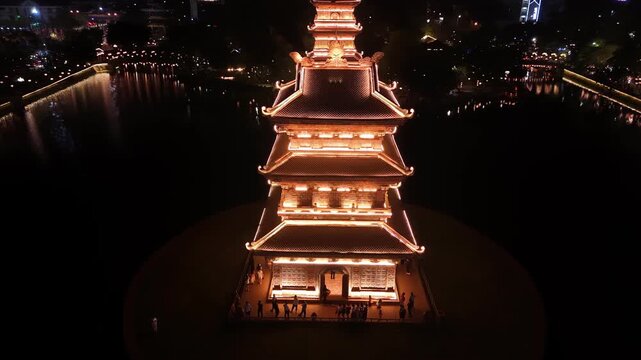 Aerial view of ancient hoa lu pagoda tower at night in ninh binh, vietnam, spiritual landmark