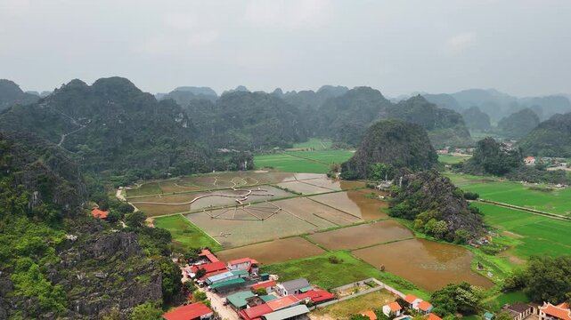 Aerial view of ninh binh landscape with rice paddies and karst mountains, vietnam