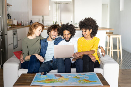 Friends meeting to plan vacations, checking map