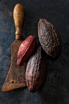 Cocoa fruit on an old cleaver