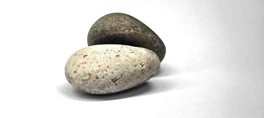 Separated sea pebbles on white background