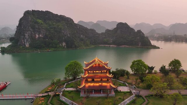 Aerial view of hoa lu ancient capital pagoda at sunset in ninh binh, vietnam with karst mountain landscape