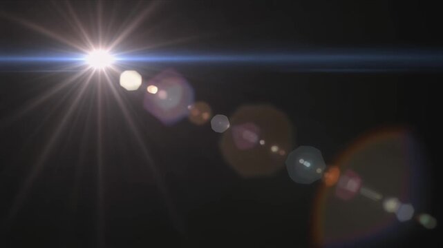 Cinematic lens flare orbs streak across dark space.