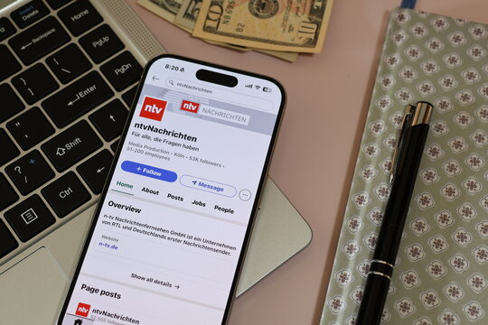 Kiel, Germany - 03-06-2026: German news media company ntv Profile on LinkedIn Displayed on a Smartphone ontop of Laptop