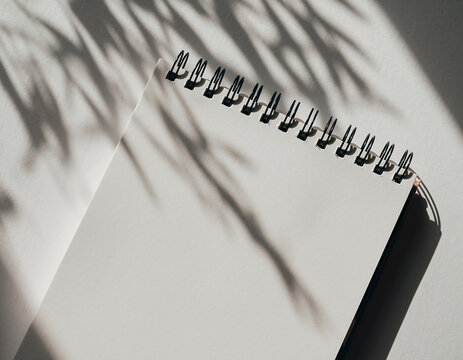 Blank calendar mockup placed on a clean minimal background. Simple planning concept ideal for scheduling, productivity, time management, business organization and stationery design templates.