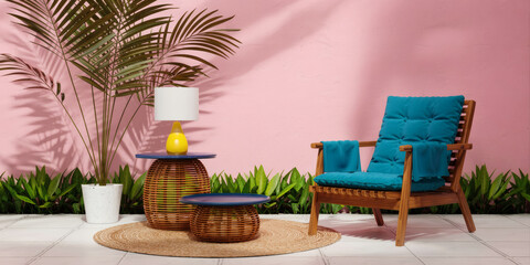 Obraz premium Tropical patio corner with blue cushioned wooden armchair, wicker tables and pink wall