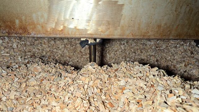 Automatic Agitator Stirring Beech Wood Chips in Industrial Smoke Generator
