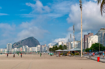 Copacabana beach with kiosk and mosaic of sidewalk in Rio de Janeiro, Brazil. Copacabana beach is the most famous beach in Rio de Janeiro. Sunny cityscape of Rio de Janeiro